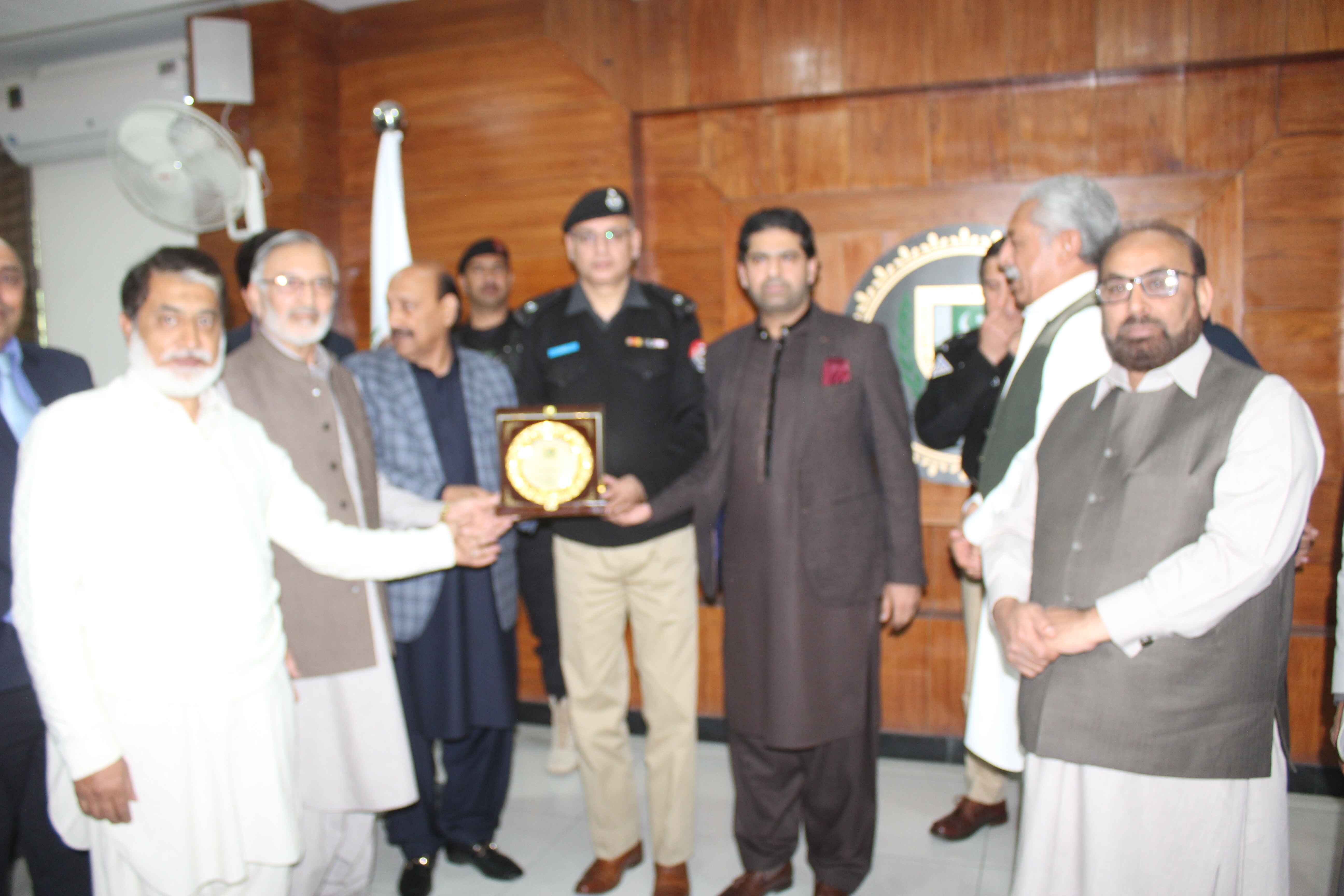 Mr. Malik Ashiq Awan, Chairman of HIA, Presents Shield to Mr. Jameel Ur Rehman SSP Investigation Haripur During HIA Visit